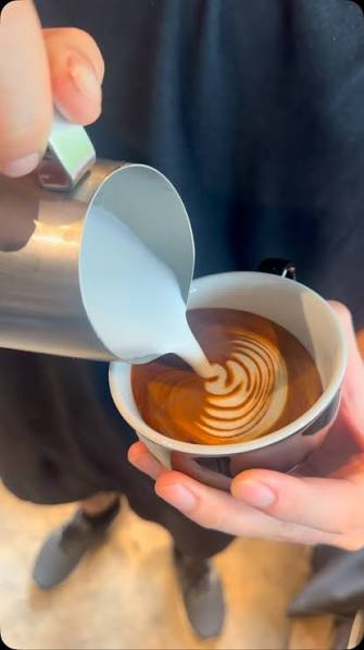 MIRA TABLE baristas preparing espresso at the coffee bar